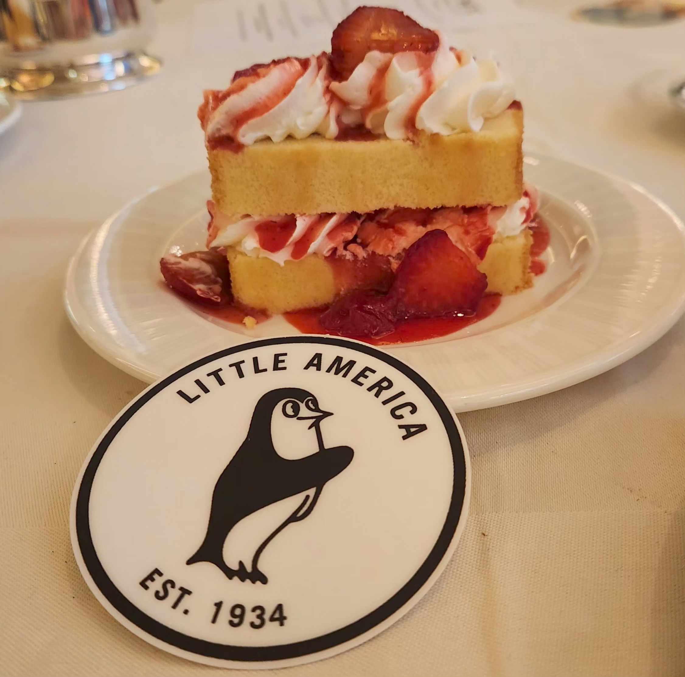 Photo of the Little America Penguin and a strawberry shortcake.