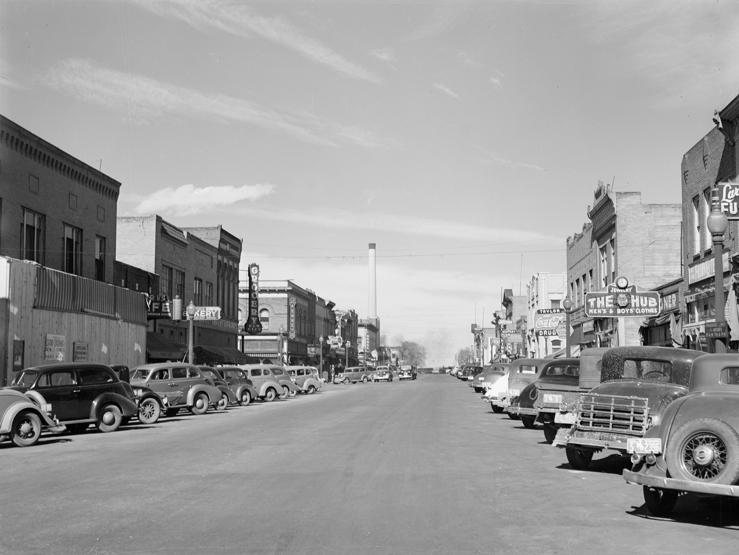 Cars and shopfronts along Main Street in Laramie, Wyoming, photographed in 1940.