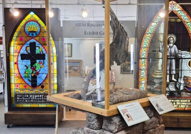 Exhibit gallery inside the Carbon County Museum in Rawlins, with stained glass windows